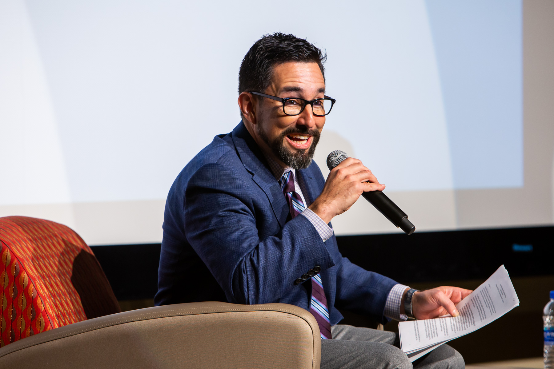 Before going into the panel discussion, Chris Tirres, associate professor of religious studies, shares a brief list of Jose Vargas's accolades in both journalism and activisim. (DePaul University/Randall Spriggs)
